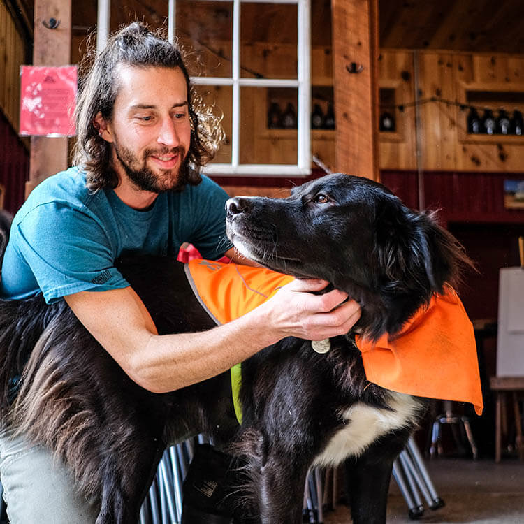 Colin, assistant brewer at Bigelow Brewery with his dog Tilly